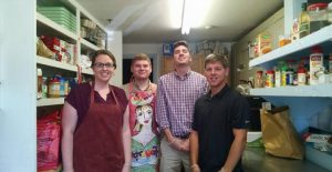 four volunteers in the food pantry