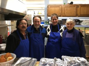 four volunteers in the kitchen from the bangor symphony orchestra