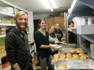 four volunteers in the kitchen