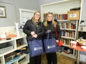 two volunteers donating needed supplies